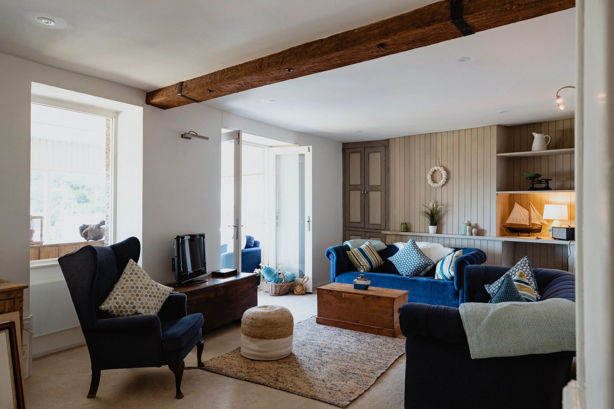 Clean living room with wall-to-wall carpet