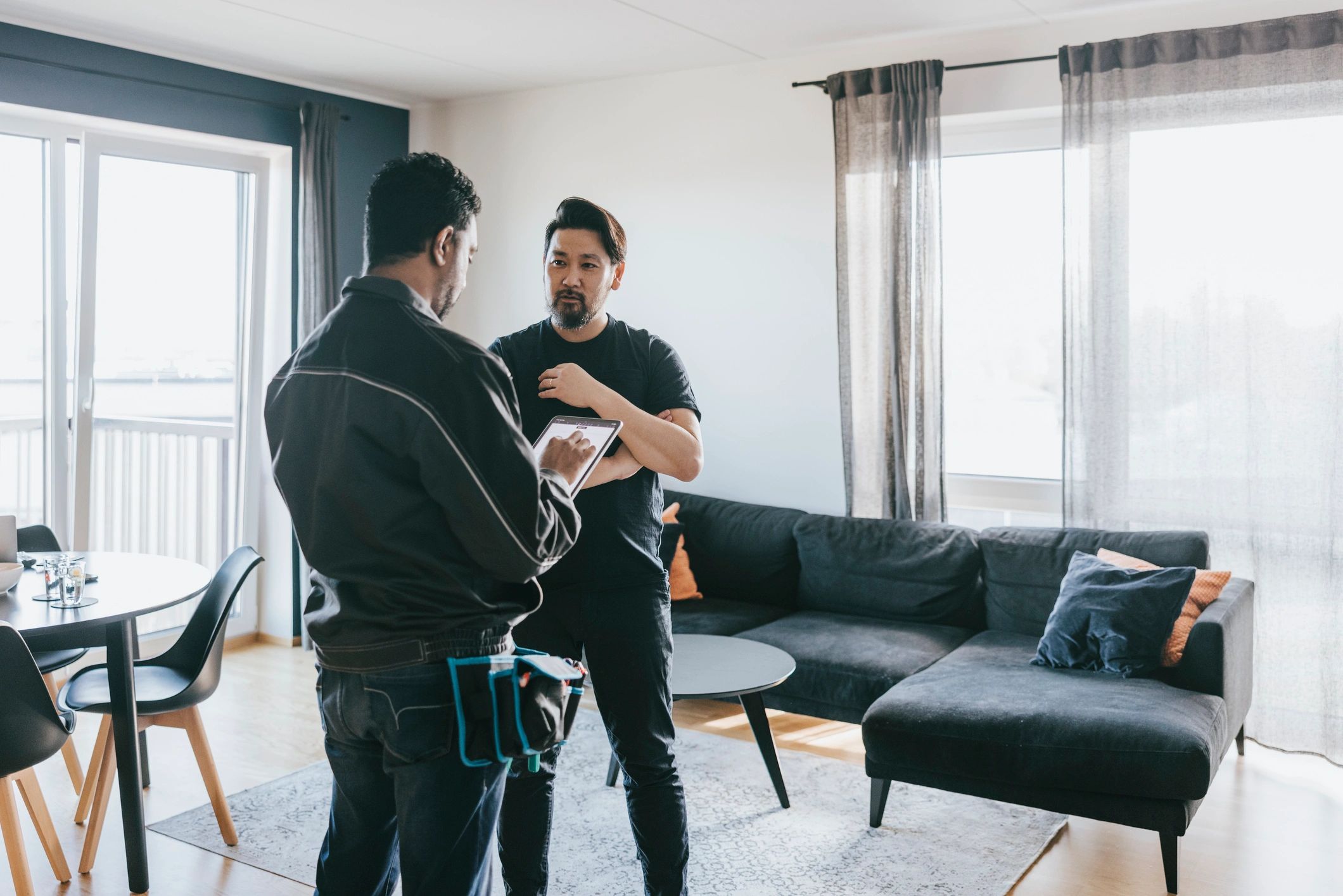 Technician speaking with a homeowner during an in-home service visit
